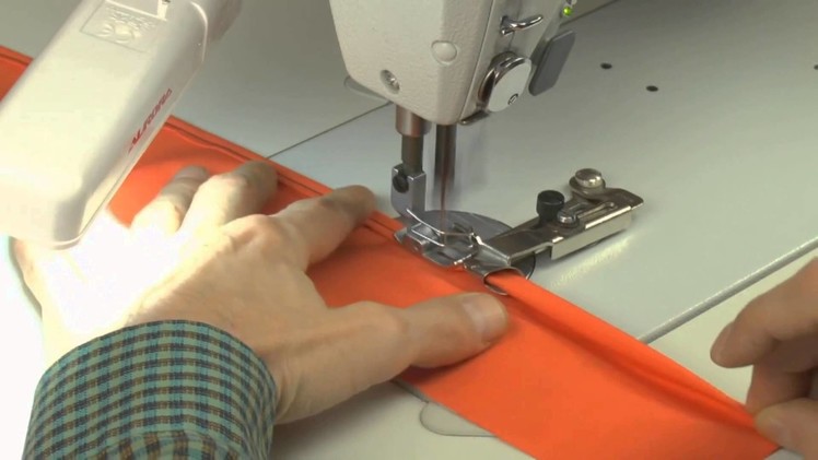 Learn How to Sew - Device for folding an edge of a fabric