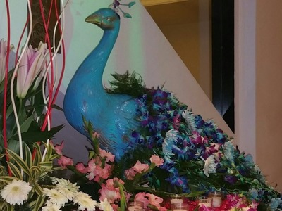 Peacock themed flower decorations for wedding 09891478183 The Pllazio Hotel Gurgaon