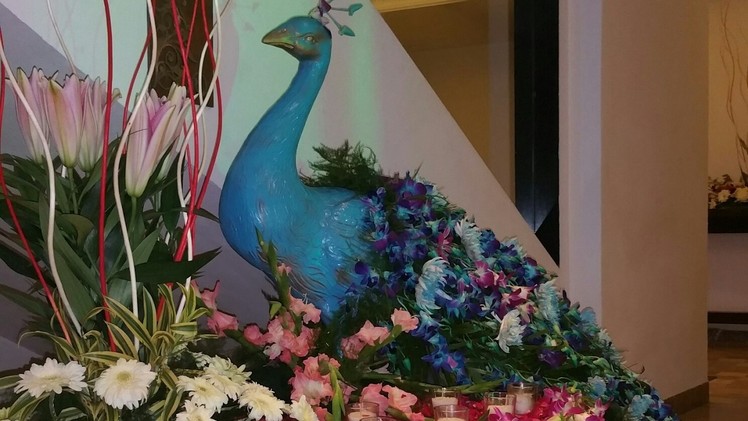Peacock themed flower decorations for wedding 09891478183 The Pllazio Hotel Gurgaon