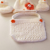 Hand knit Baby girl set with hat, bib and booties. White with orange accents