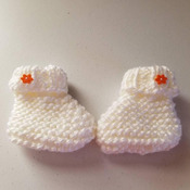 Hand knit Baby girl set with hat, bib and booties. White with orange accents
