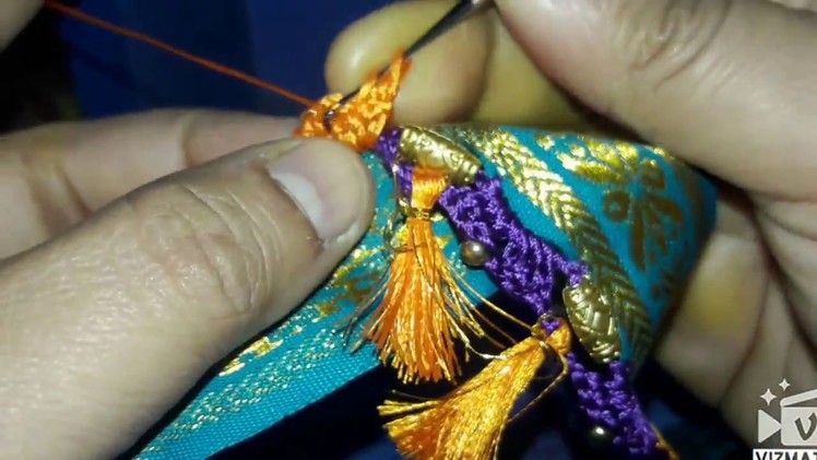 Traditional crochet saree kuchu design wt beads and tassels for Indian silk saree