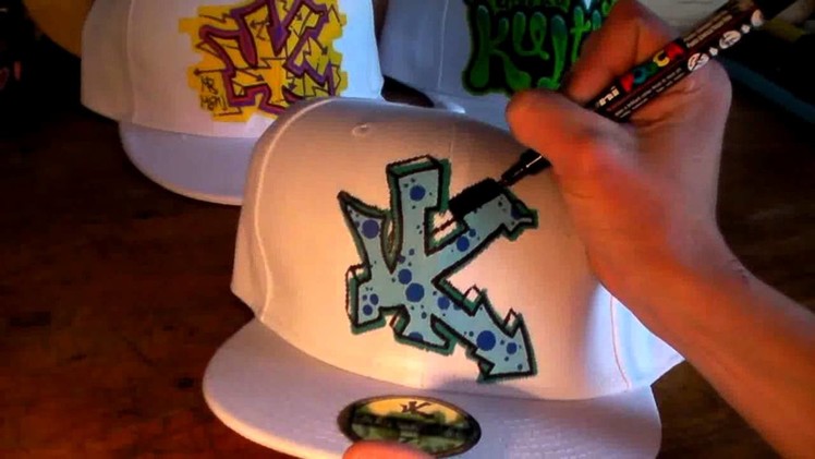 HOW TO GRAFFITI A HAT #5 letters street art tag draw spray paint tutorial hip hop artist new era cap