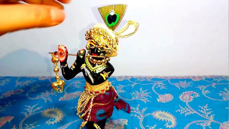Decorate Krishna with golden beads. . . 