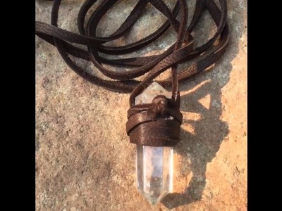 Double terminated quartz crystal wrapped with soft brown leather. Item no 3