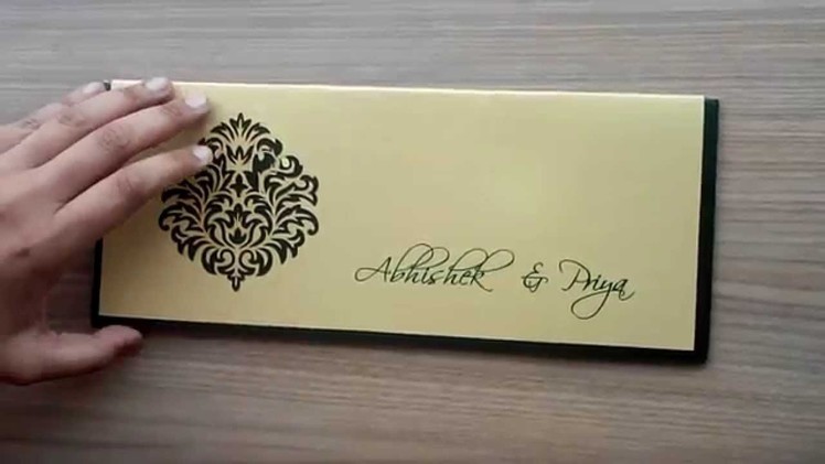 Indian Wedding Card in Dark Green and Golden with Cutout Design