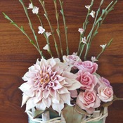 Handmade cold porcelain flower bouquet.dhalia and roses in wooden vase