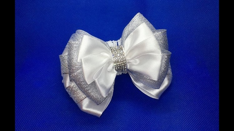 Decoration on children's headband Kanzashi. Lush white-silver bow