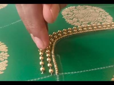Highlighting the brocade work using beads on a designer blouse