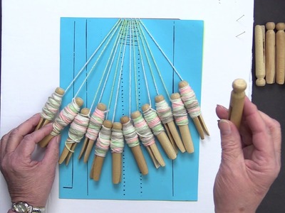 Bobbin lace DIY kit with yarn and clothes pins for bobbins