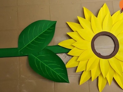 Making paper sunflower costume.