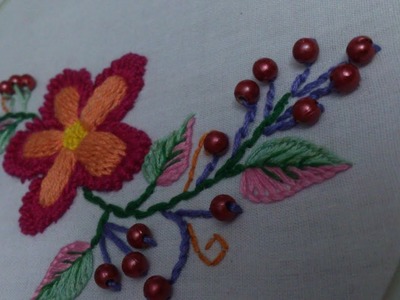 Hand embroidery. Raised stem stitch and bullion lazy daisy stitch.