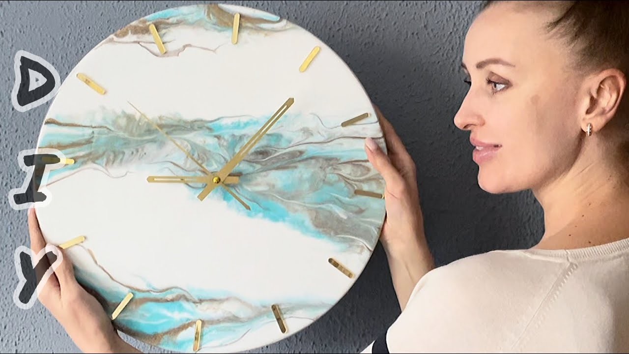 DIY. Wall clock made of epoxy resin. White, blue and gold.