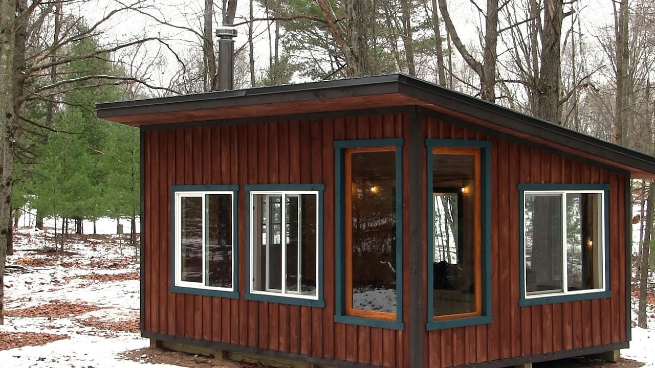 Building a cozy off grid cabin in the woods start to finish