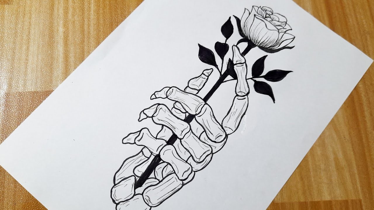 How to draw a skeleton hand holding a rose