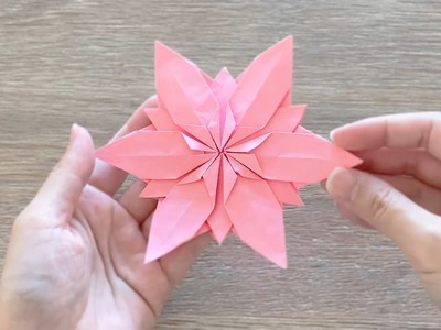 Origami Flower. Christmas Origami Snowflake