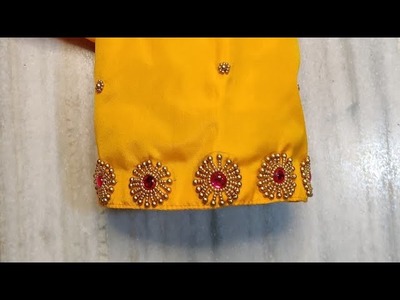 Easy bead work design on stitched blouse.