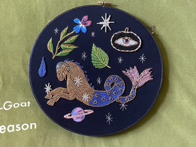 Embroidering and beading a Capricorn Hoop