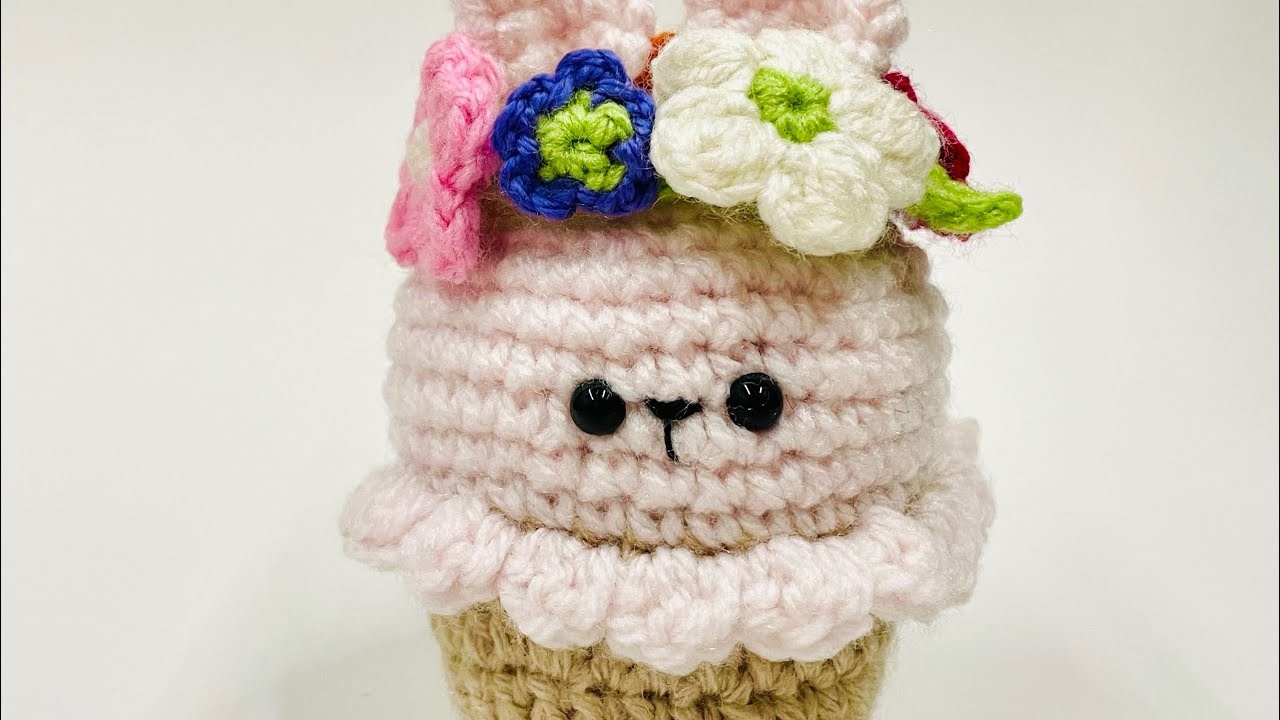 Crochet rabbit cupcake with flower wreath