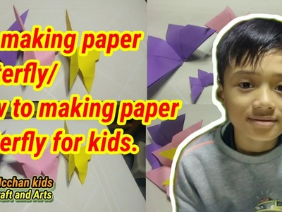 Kid making paper butterfly.How to make paper butterfly for kids as a tutorial.