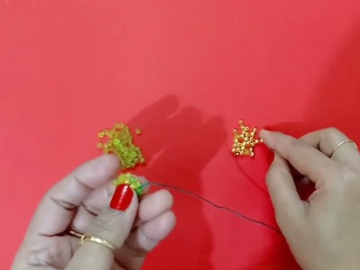 DIY star shaped green earrings at home.