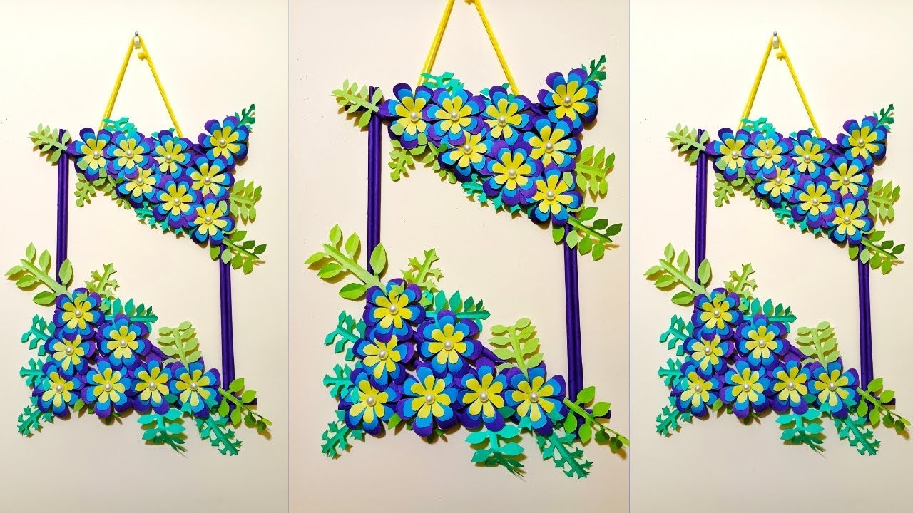 Very beautiful wall flower design made of purple color paper.#paper #craft #art #viralvideo