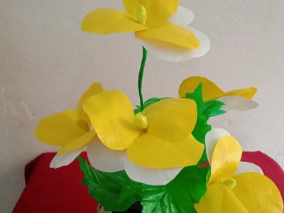 The easiest way to make decorative yellow and white pansies from used plastic bags