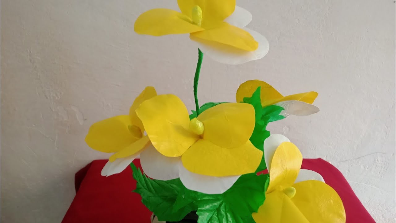 The easiest way to make decorative yellow and white pansies from used plastic bags