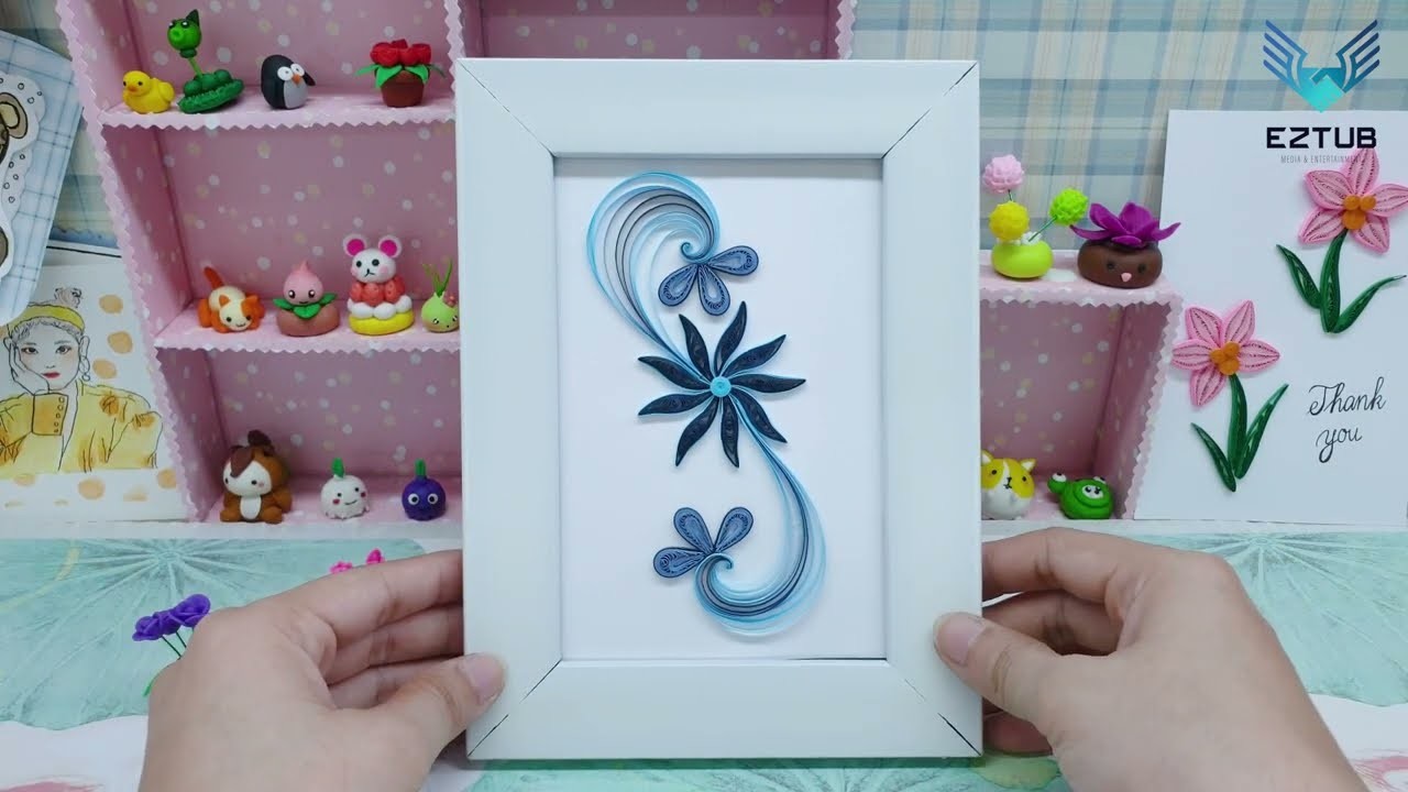 Creating Perfectly Symmetrical Blue Flower Decorations with Paper Quilling