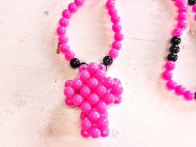 Making a cross necklace with beads. . #beads making #necklace #beads