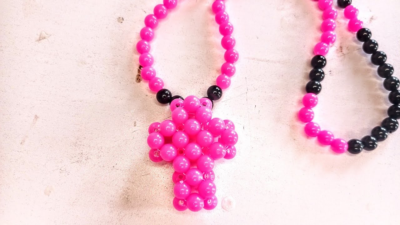 Making a cross necklace with beads. . #beads making #necklace #beads