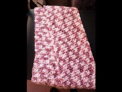 Crocheting eco cozy watercolors scarf, which is made from recycled plastic.