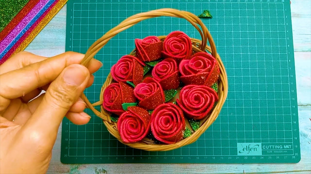 Teaching how to make flower baskets A basket of miniature roses, a gift of rose from glitter foam.