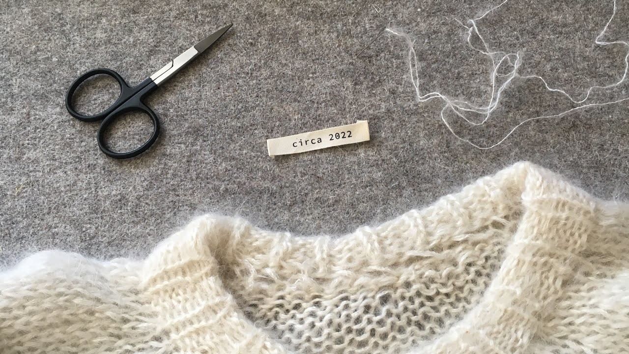 How to sew a label on a knitted sweater