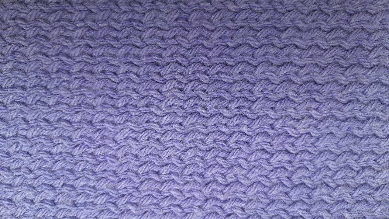 Punto ingles oblicuo.Scarf knitted in oblique English rib