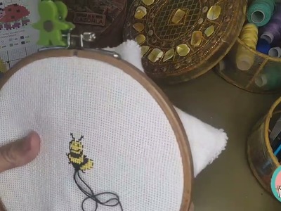 I used a hand sewing thread to cross stitch a Bee ????