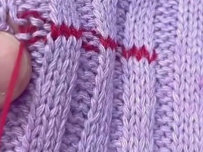Repairing holes in sweater with three stitches above and two stitches under
