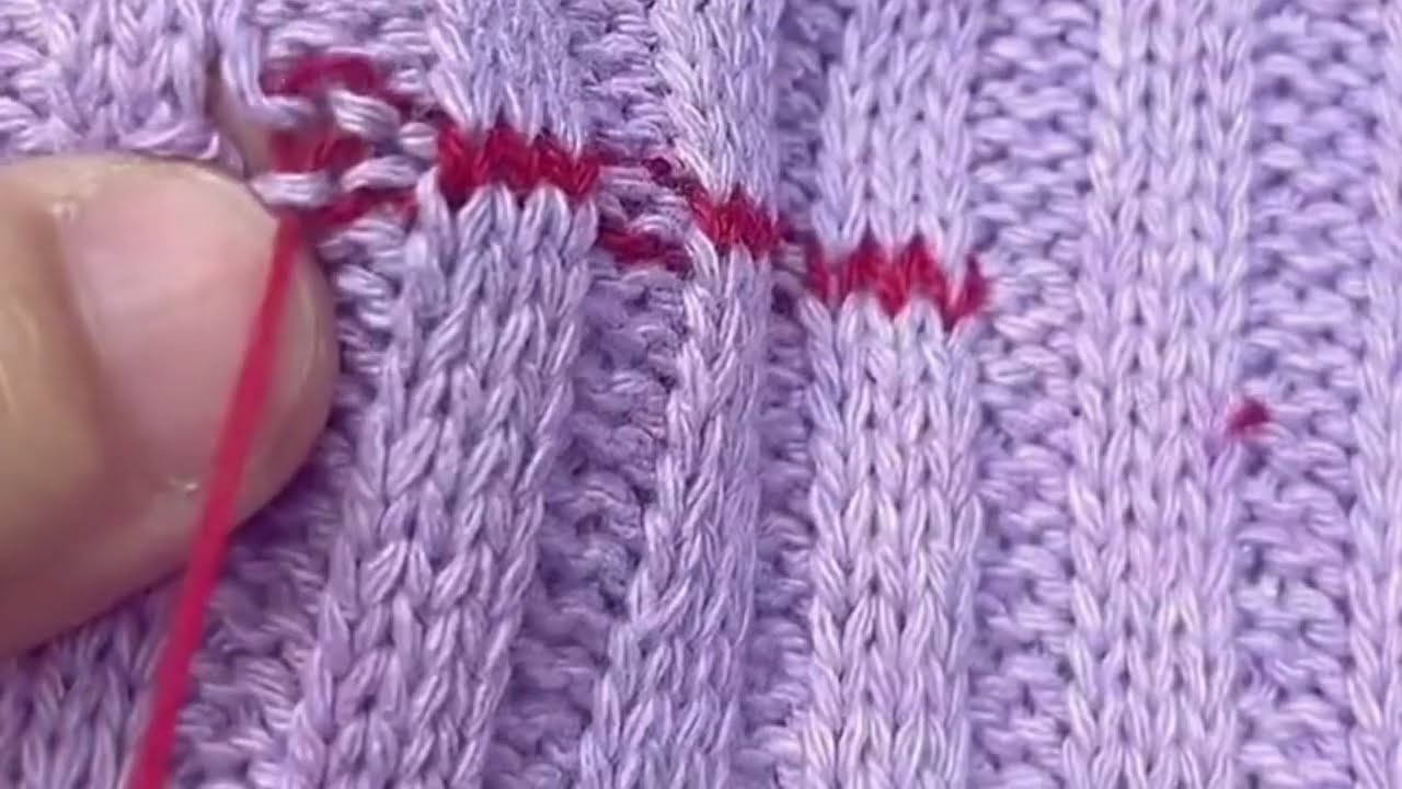 Repairing holes in sweater with three stitches above and two stitches under