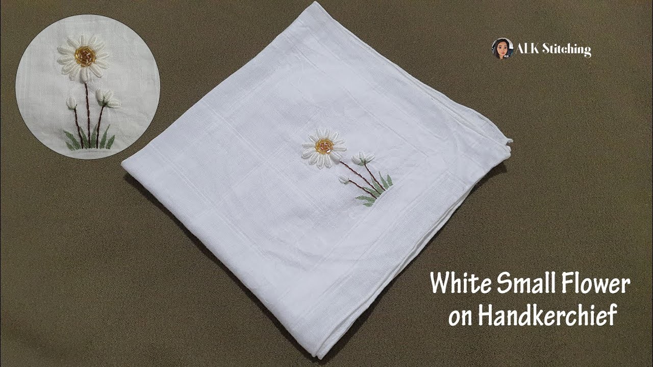 White small flower on handkerchief with simple stitches