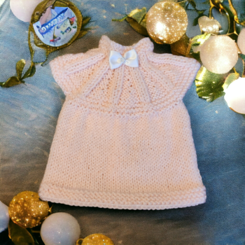 A beautifully hand knitted preemie baby dress 3 premature sizes available soft peach