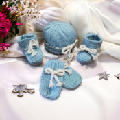 Hand knitted newborn baby gift set comprising of mittens hat and booties